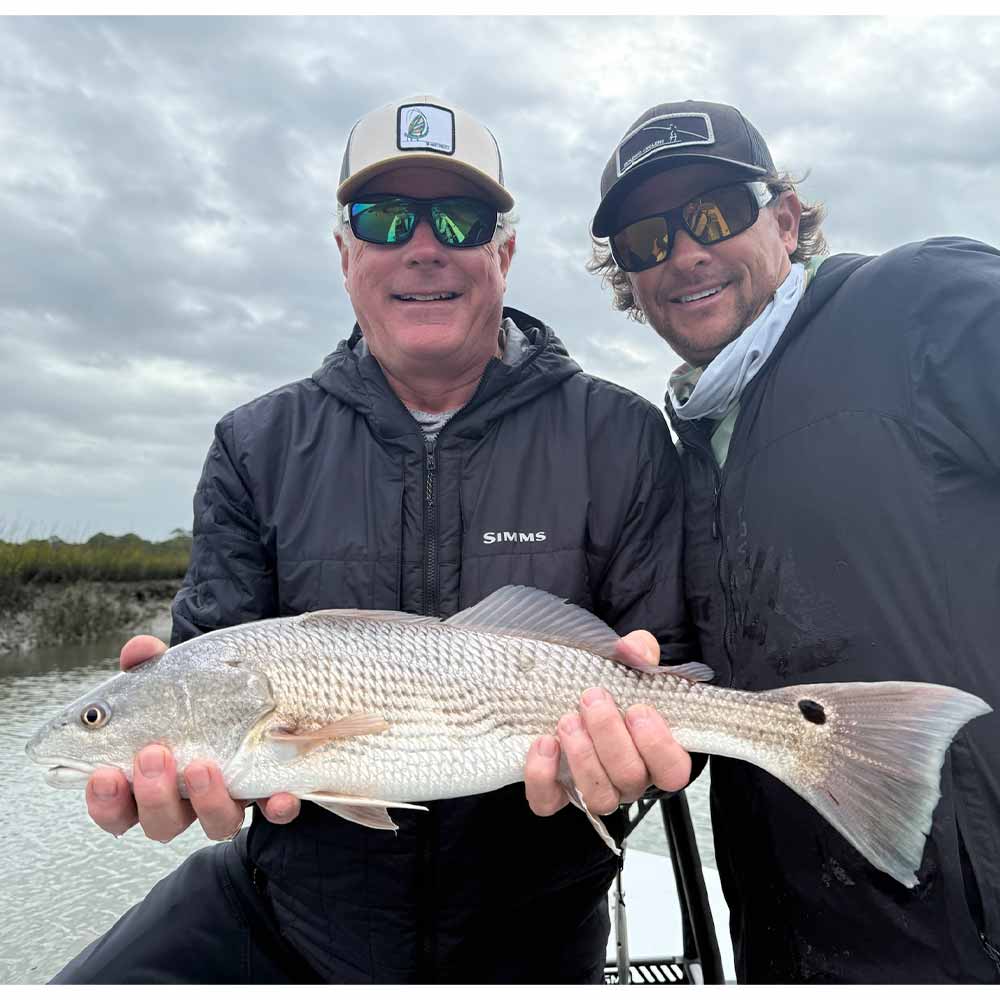 Captain Tuck Scott with a pleased client