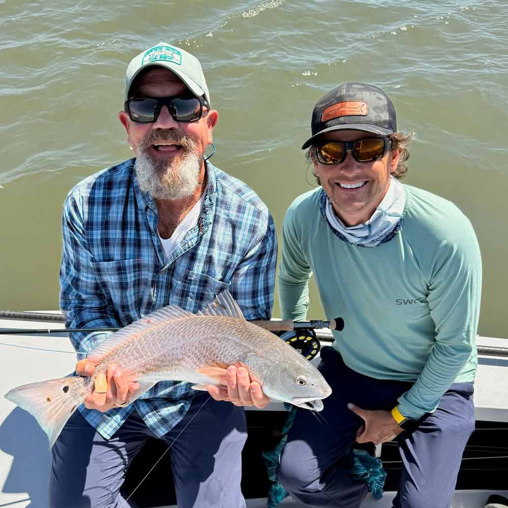 Captain Tuck Scott and a happy client