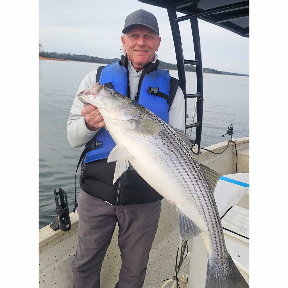 Captain Rocky Fulmer with a 25-pound striped bass