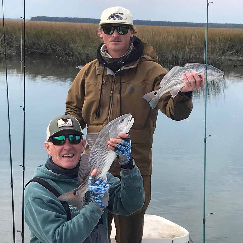 Captain Greg Holmes catching fish in the backs 