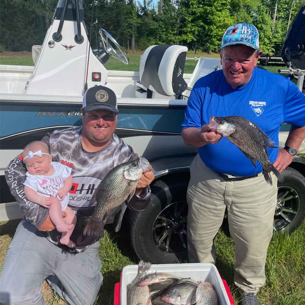 Roland Addy with his new fishing buddy and his old one