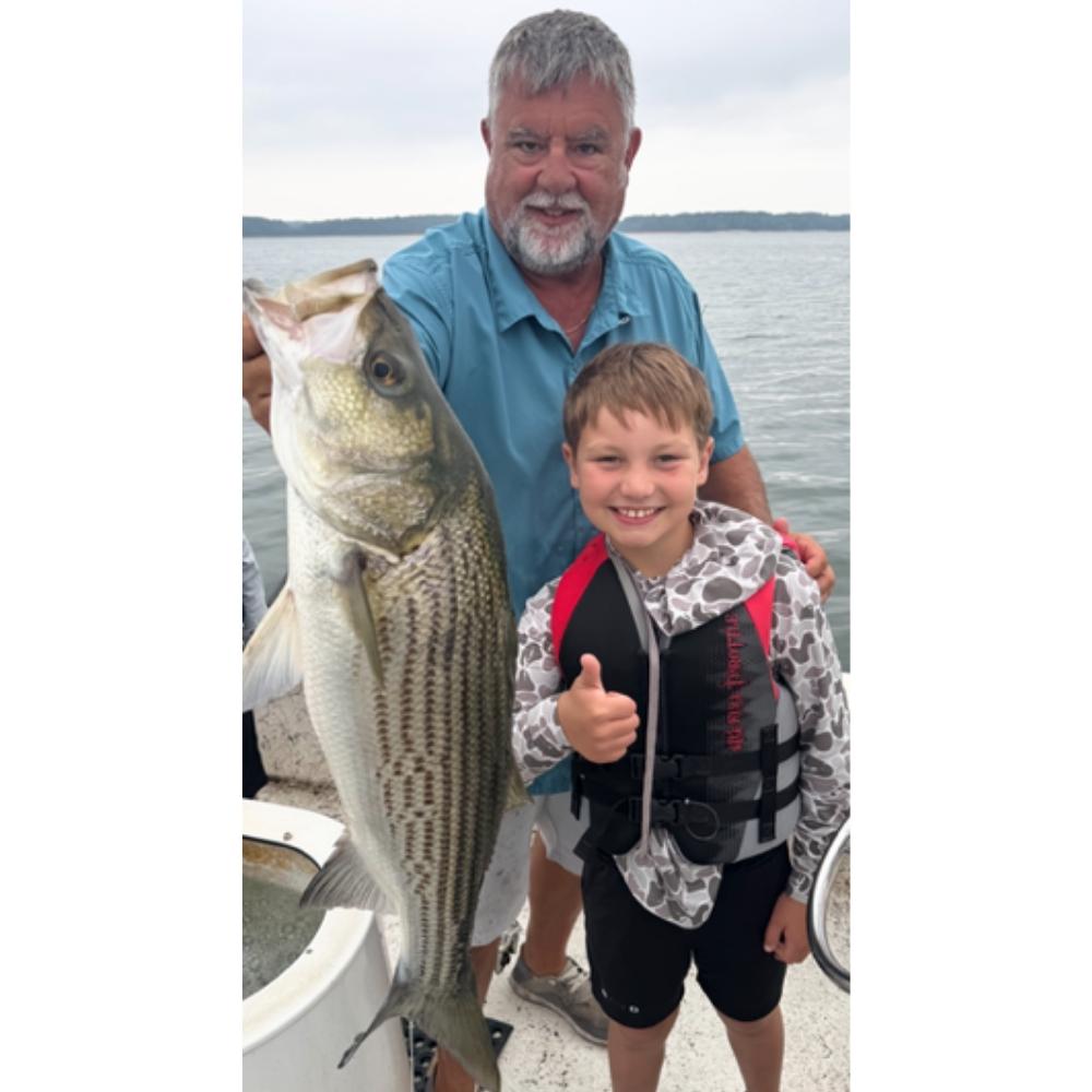 Captain Chip Hamilton and a happy client