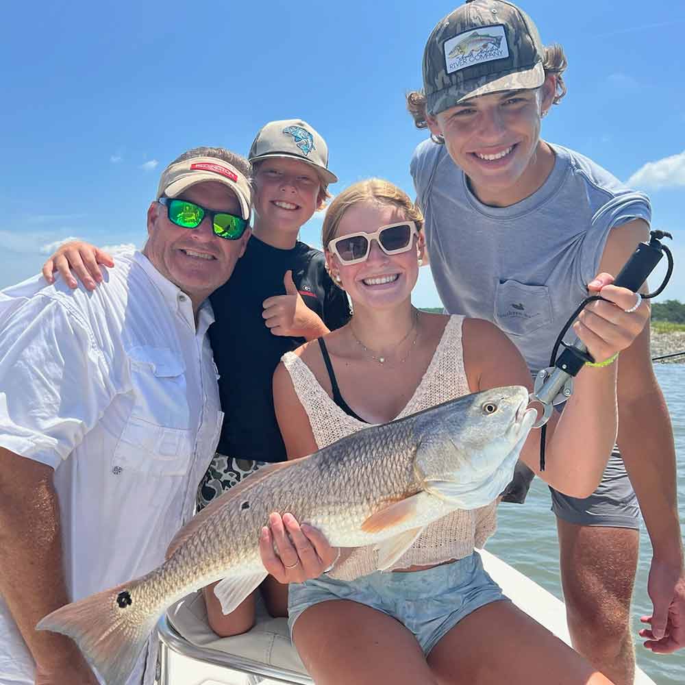 A happy family fishing with Captain Trent Malphrus