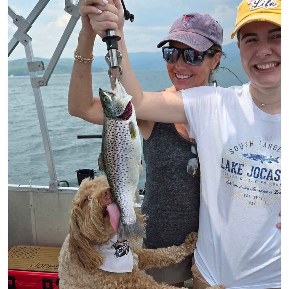 "Fisher" enjoys the catch of the day with Jocassee Charters