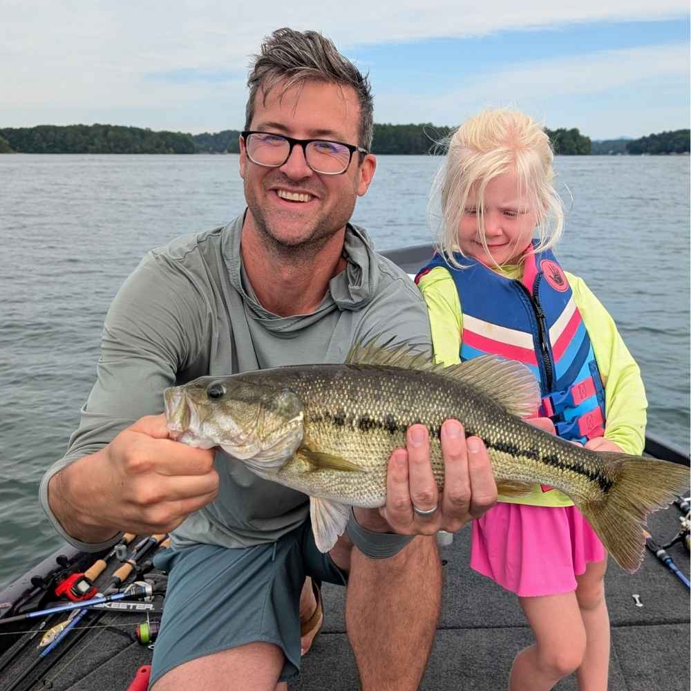 Happy anglers caught this spotted bass on top with Guide Charles Townson