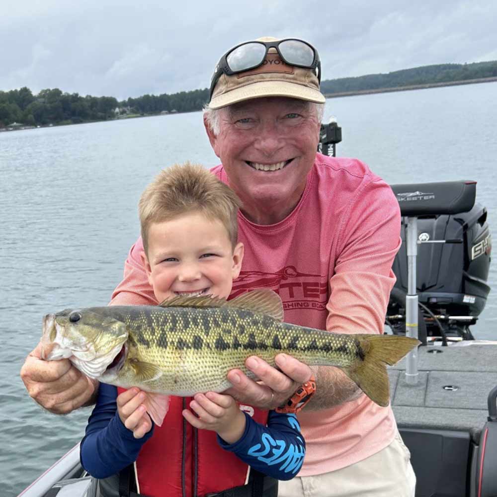 Charles Townson and a young angler with a fish caught on a jigging spoon yesterday