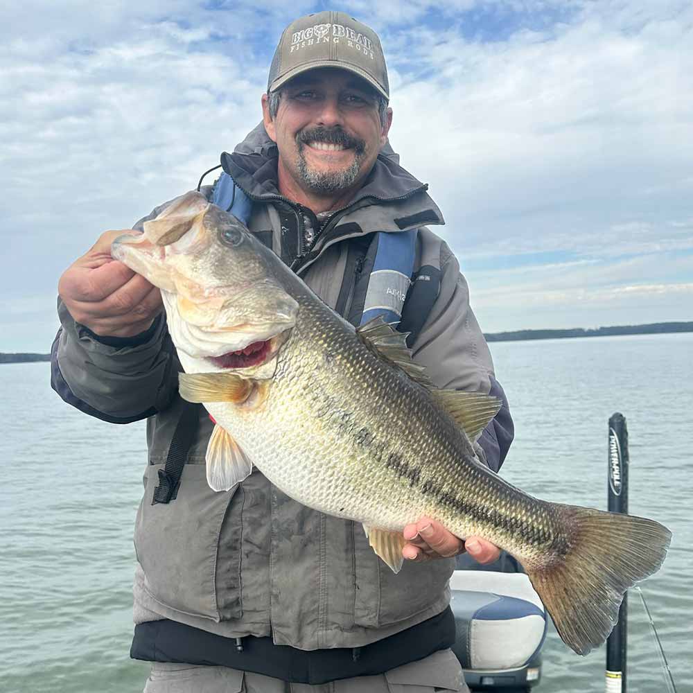 Eric Enlow with a pig this Sunday on Lake Monticello