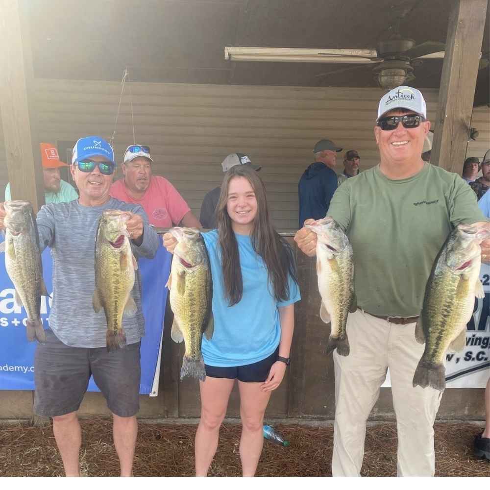 Dearal, Sarah Rodgers, and Trent with their winning bag
